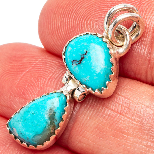 Turquoise double-drop pendant in sterling silver, close-up of bezel-set teardrop stones