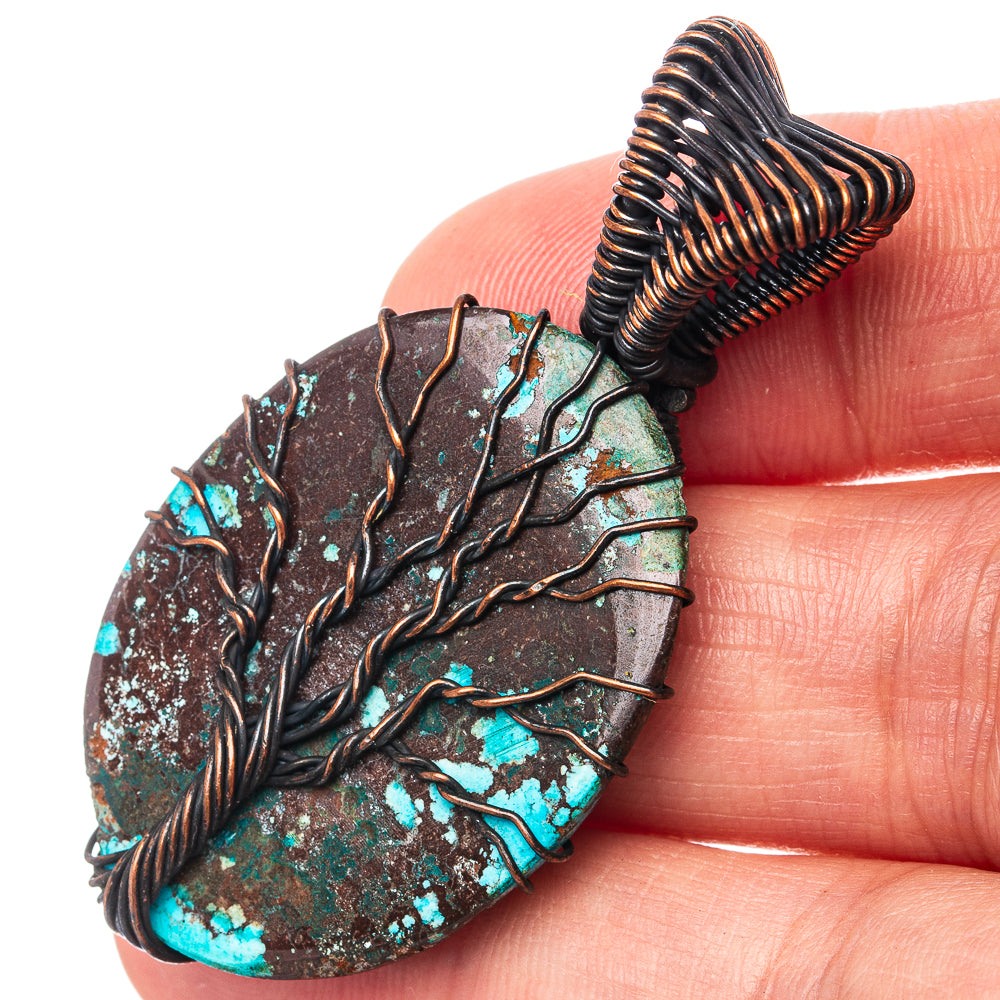 Oxidized copper Tree of Life pendant close-up with turquoise patina and wire tree detail