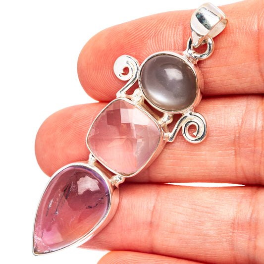 Sterling silver pendant with oval pink, purple, and gray gemstones in bezel settings