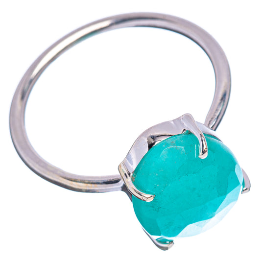 Silver ring with oval turquoise gemstone held by four prongs