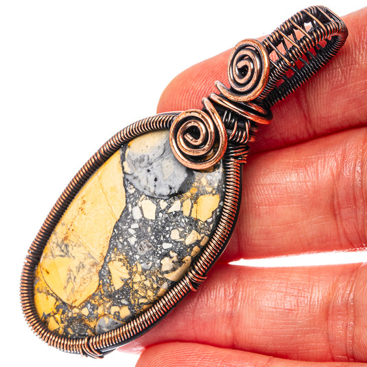 Oxidized copper wire-wrap pendant with oval yellow-and-blue jasper stone