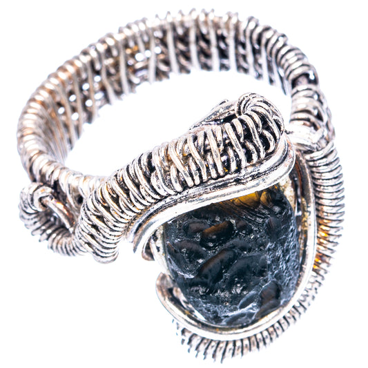 Rope-textured sterling silver tektite ring with oval black stone and thick side band