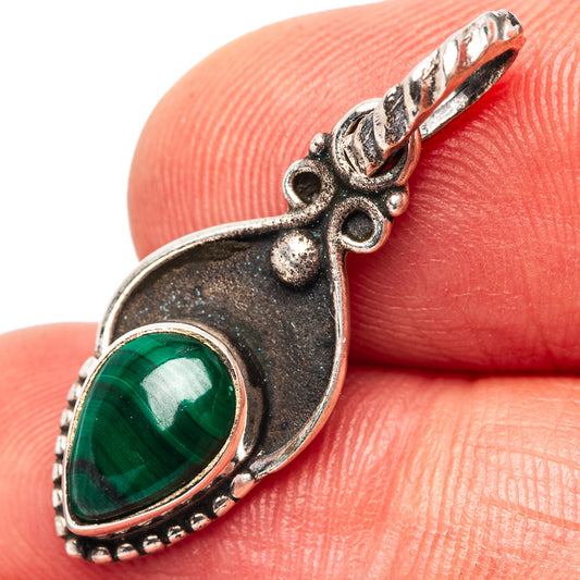 Sterling silver malachite pendant with oval green cabochon, ornate bail and frame