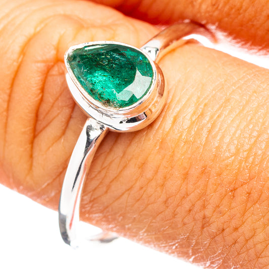 Sterling silver ring with pear-shaped green emerald gemstone bezel