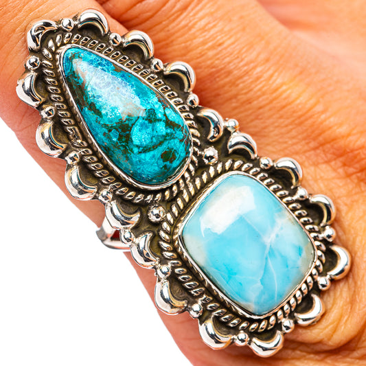 Sterling silver ring with two oval turquoise cabochon stones and ornate border setting