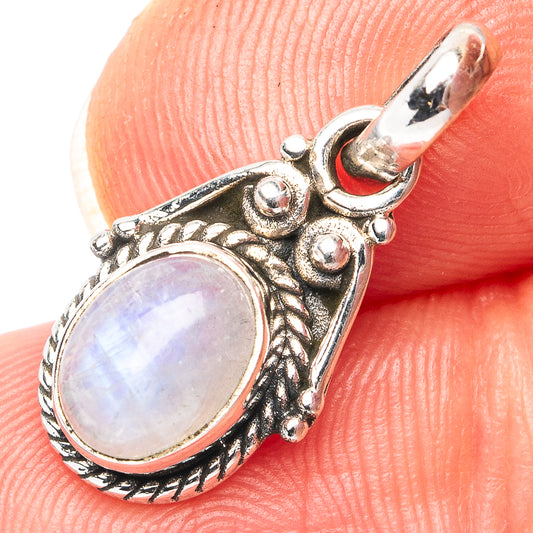 Oval moonstone pendant in antiqued sterling silver setting, close-up with textured bail