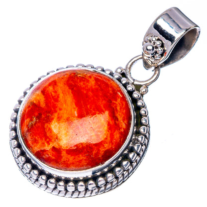 Sterling silver sponge coral pendant with orange cabochon, textured bezel, and bail