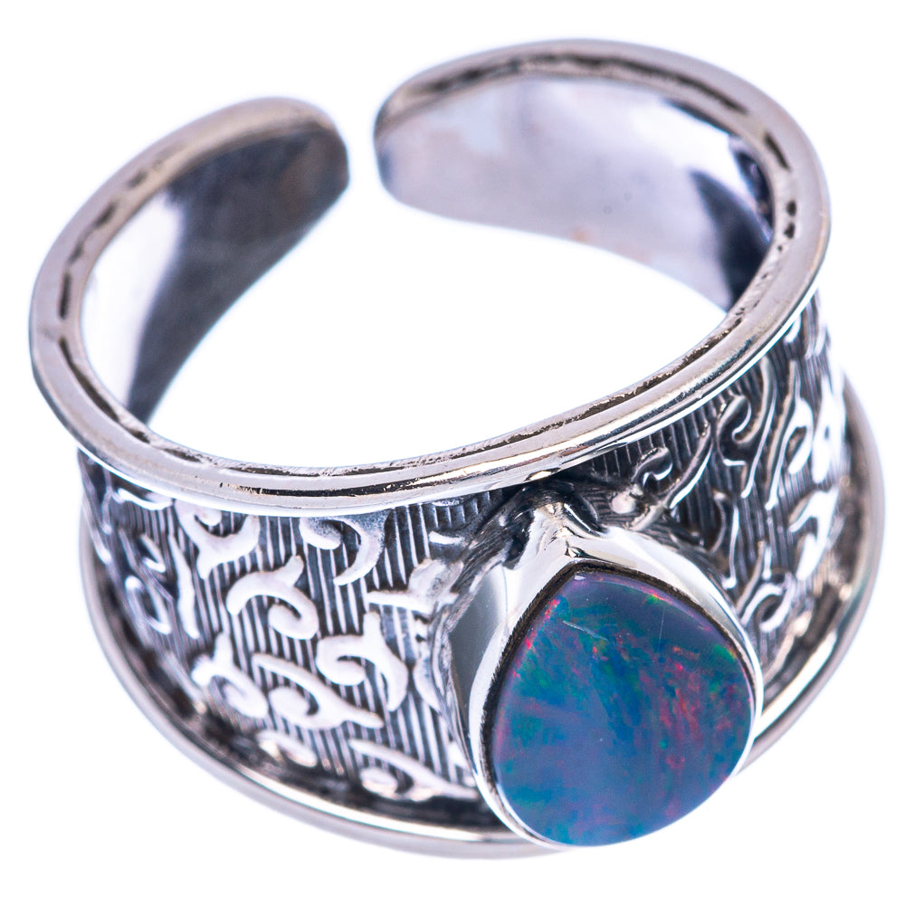 Sterling silver ring with dark blue opal cabochon and decorative etched band