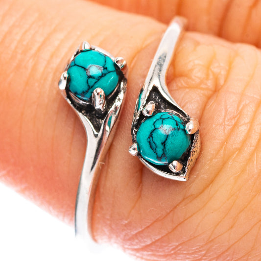 Sterling silver ring with turquoise oval cabochon, prong setting detail