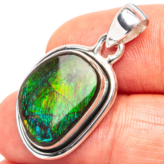 Sterling silver ammolite pendant with oval iridescent green-blue stone bezel