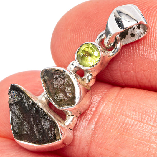 Sterling silver pendant with rough dark green Moldavite and round peridot gemstone