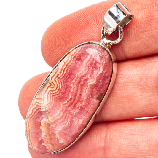 Rhodocrosite pendant in oval cabochon with .925 sterling silver bezel and bail