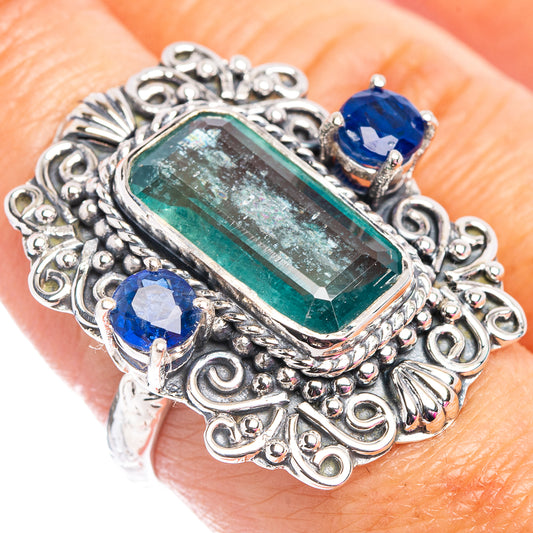 Sterling silver ring with rectangular green gemstone and three blue accent stones