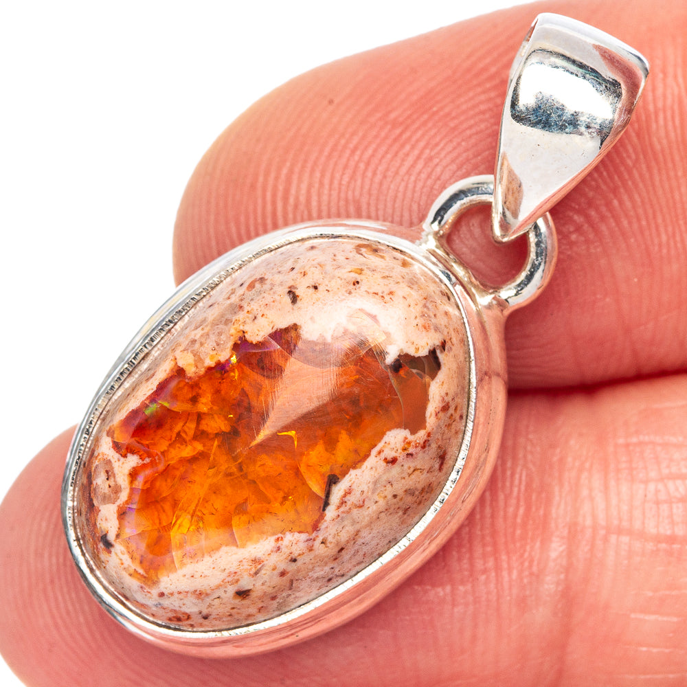 Oval 925 sterling silver fire opal pendant with fiery orange-red gemstone in bezel