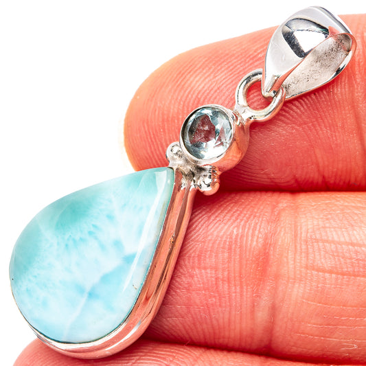 Sterling silver pendant with pear-cut larimar teardrop and round blue topaz, bail