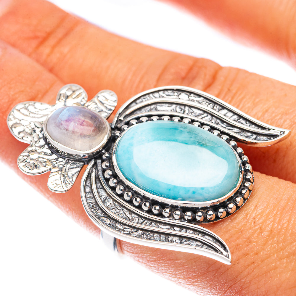 925 sterling silver ring with oval blue and white gemstones, ornate side accents