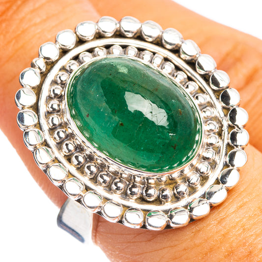 Sterling silver adjustable ring with large oval green gemstone and bead halo