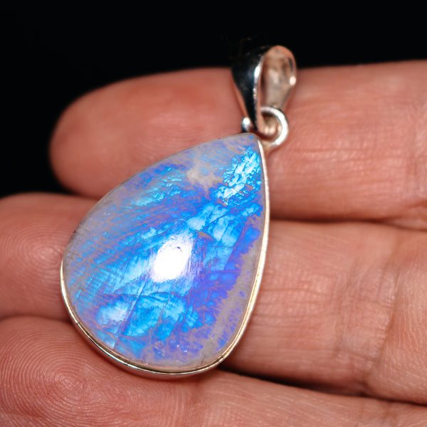 Teardrop rainbow moonstone pendant in .925 sterling silver with silver loop