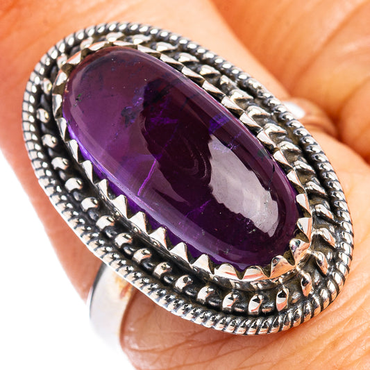 Sterling silver amethyst oval ring close-up with textured rope setting, size 7.
