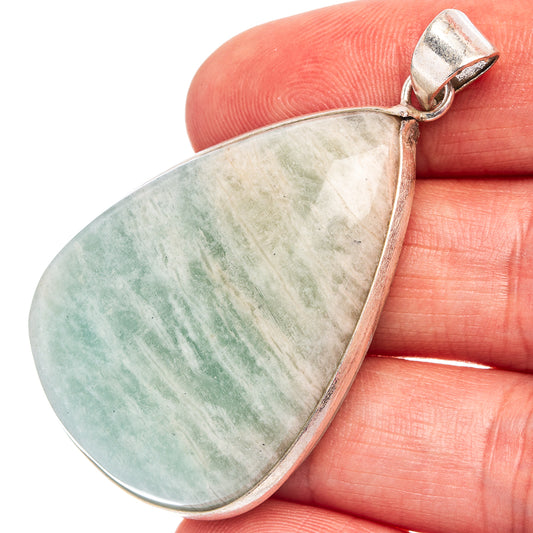 Teardrop amazonite gemstone pendant with silver-plated bail, close-up of stone texture
