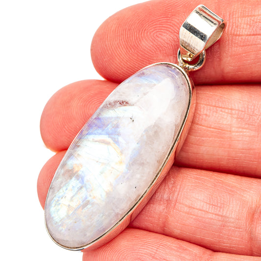 Oval rainbow moonstone pendant in .925 sterling silver, silver bail and bezel