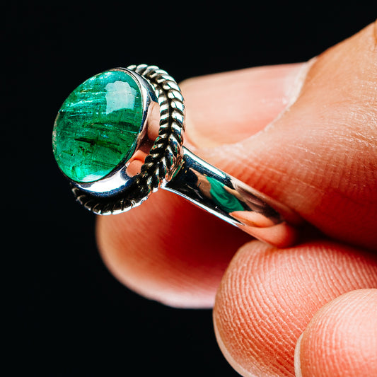 Side view of green oval emerald cabochon sterling silver ring with rope detailing