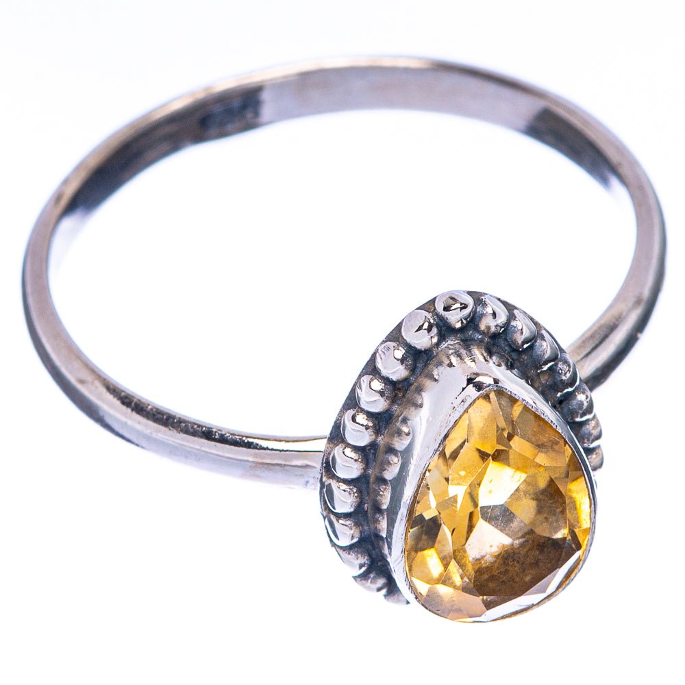 Sterling silver ring with pear-shaped faceted citrine gemstone, openwork halo band