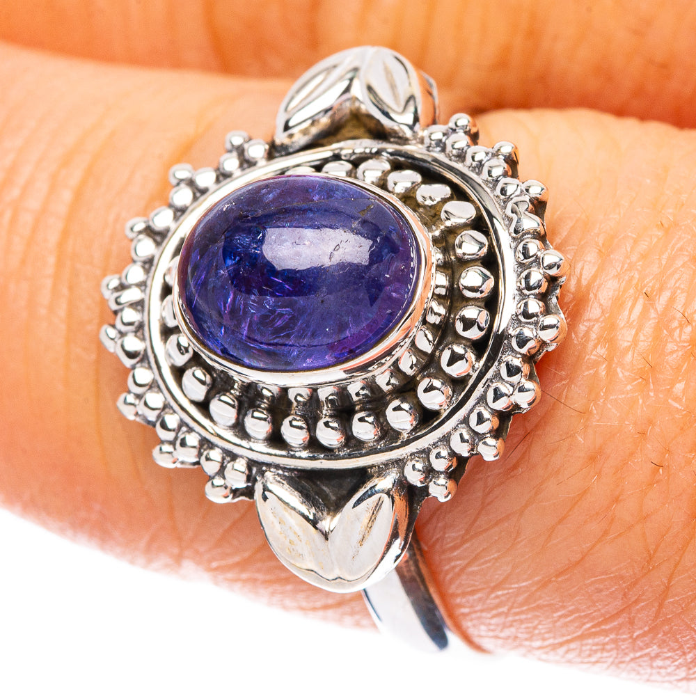 Sterling silver tanzanite ring with oval blue gemstone and scalloped halo, size 8.25