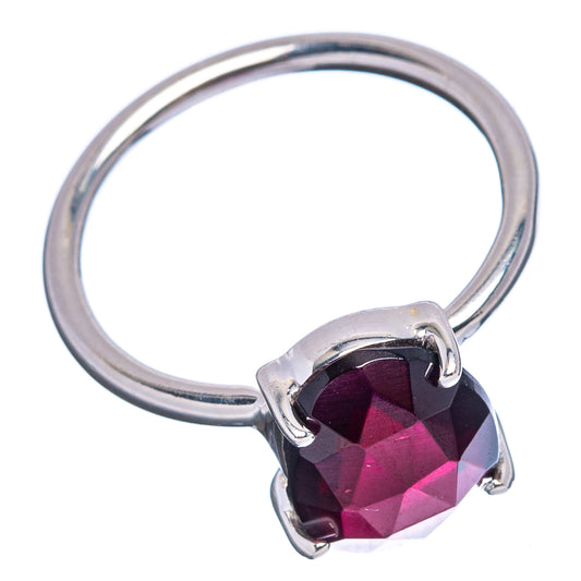 Sterling silver ring with oval faceted garnet stone and split band
