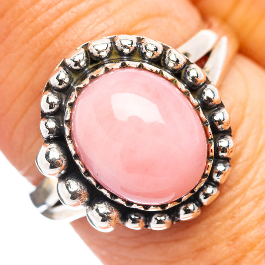 Sterling silver ring with pink oval opal cabochon and beaded bezel border