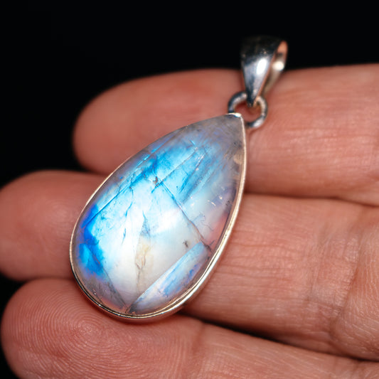 Pear-shaped rainbow moonstone pendant in .925 sterling silver bezel setting