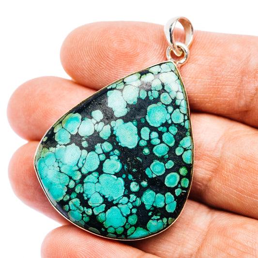Teardrop turquoise pendant with black matrix, .925 sterling silver bail