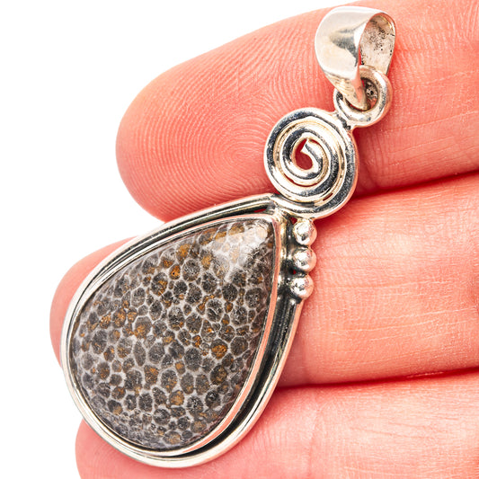 Sterling silver teardrop pendant with speckled stone and swirl bail, top loop