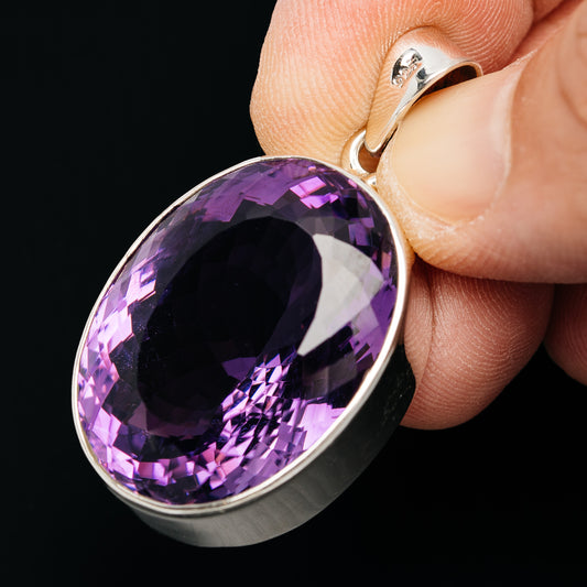Large oval faceted amethyst pendant with .925 sterling silver bezel