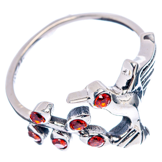 Sterling silver hummingbird dainty ring with red-orange gemstone accents, band visible