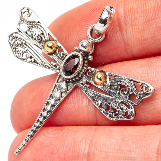 Sterling silver dragonfly pendant with red garnet-like stones and engraved details