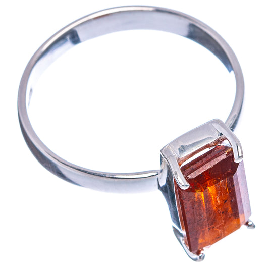 Sterling silver ring with orange-red rectangular stone, angled side view, four prongs