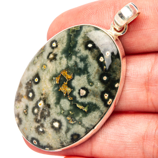 Ocean jasper pendant on silver bail, green-gray druzy look with gold star flecks