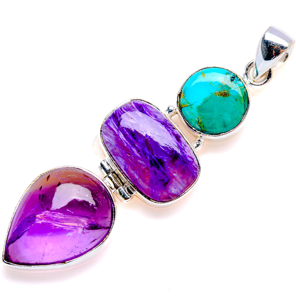 Sterling silver pendant with three cabochon stones in purple, turquoise, and pink-red.