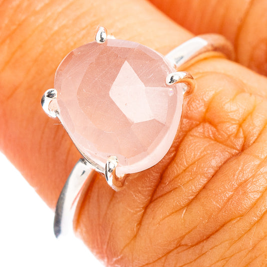 Faceted rose quartz ring with pink stone in .925 sterling silver prongs, close-up