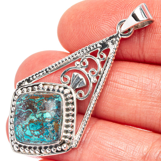 Sterling silver chrysocolla pendant with turquoise stone and ornate frame, top bail