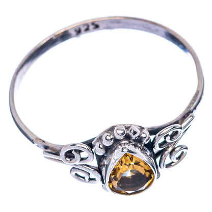Sterling silver ring band with faceted yellow citrine and swirling openwork bezel