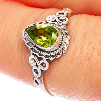 Sterling silver peridot dainty ring with oval green gemstone and ornate band