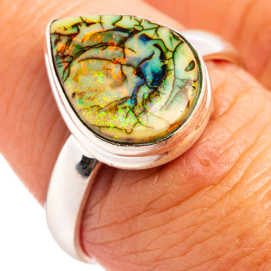 Sterling silver opal ring with oval multicolor opal stone, close-up on top setting
