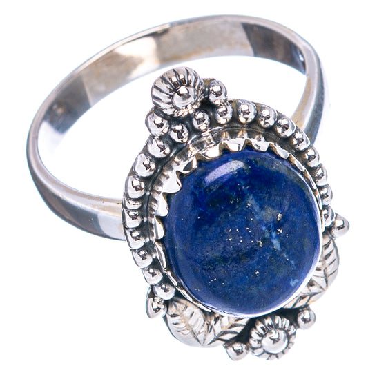 Sterling silver ring with oval blue lapis cabochon and raised leaf-and-bead border
