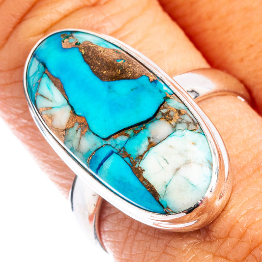 Sterling silver ring featuring a turquoise oval cabochon with brown matrix inlay