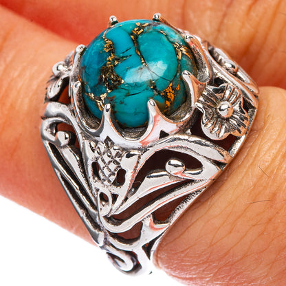 Sterling silver ring with oval turquoise cabochon and ornate filigree setting