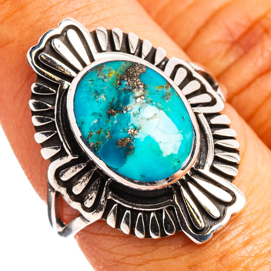 Turquoise oval sterling silver ring with ornate sunburst bezel, dark patina