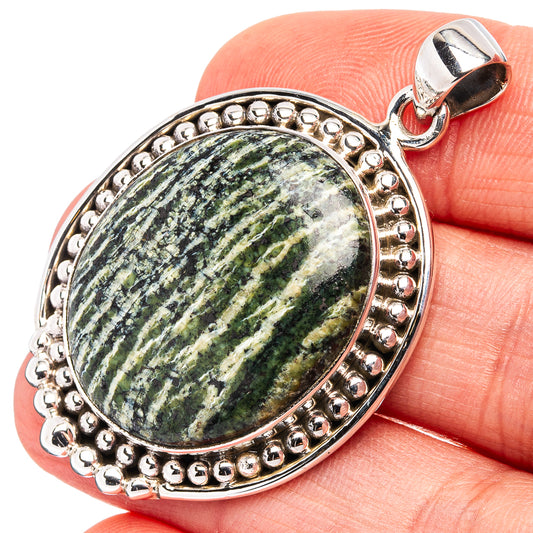 Oval green opal pendant in .925 sterling silver beaded bezel with loop bail
