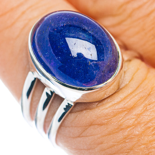 Sterling silver ring with oval blue-purple cabochon gemstone bezel setting.